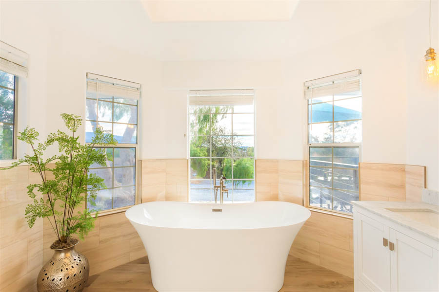 large bathroom with shower and soaking tub
