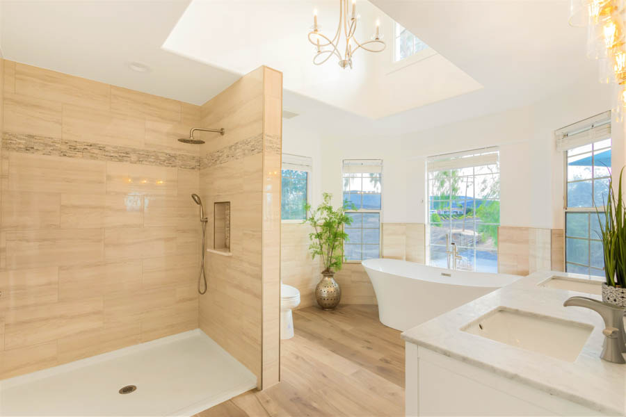 large bathroom with shower and soaking tub